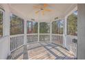 Wooden gazebo with white railings offering scenic wooded views at 4816 8Th Tee Dr, Hollywood, SC 29449