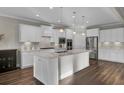 Modern kitchen featuring white cabinets and a large island at 482 Hidden Meadow Ln, Summerville, SC 29486