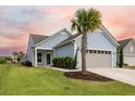 Light blue house with gray garage and palm tree in front yard at 531 Switchgrass Dr, Summerville, SC 29486