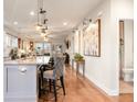 Open kitchen with granite island, stainless steel appliances, and hardwood floors at 531 Switchgrass Dr, Summerville, SC 29486