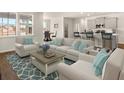 Spacious living room with light beige sofas and a coffee table at 569 Richfield Way, Summerville, SC 29486