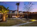 Relaxing patio area with fire pit and seating, surrounded by a fence at 711 Blueway Ave, Summerville, SC 29486