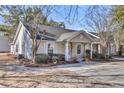 Tan colored house with white trim and landscaping at 7936 Vermont Rd, North Charleston, SC 29418