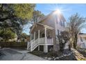 Two-story house with a front porch and sunny aspect at 882 Sedge Ct, Charleston, SC 29412
