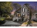 Two-story house with a front porch at dusk at 882 Sedge Ct, Charleston, SC 29412