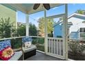 Relaxing screened porch with wicker furniture and view of backyard at 103 Green Grass Rd, Summerville, SC 29483