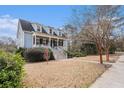 Two-story home with a charming front porch and walkway at 1034 Bradbury Ln, Charleston, SC 29492