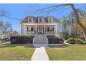 Charming two-story home with front porch and landscaped yard at 1034 Bradbury Ln, Charleston, SC 29492