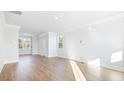 Sunlit living room with hardwood floors and a view of the backyard at 120 Midmills Ln, Summerville, SC 29486