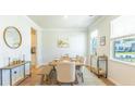 Spacious dining area with hardwood floors, neutral walls and large windows at 126 Lilac Grove Way, Summerville, SC 29486