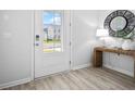 Modern entryway with a console table and mirror, hardwood floors at 129 Lilac Grove Way, Summerville, SC 29486