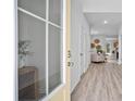 Bright entryway with light yellow door and view into the living room at 129 Lilac Grove Way, Summerville, SC 29486