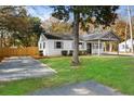 Charming white house with a gravel driveway at 1558 Burnswick Dr, Johns Island, SC 29455