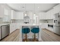 Bright white kitchen with center island and stainless steel appliances at 1669 Indy Dr, North Charleston, SC 29405
