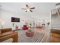 Open living room with modern furnishings and a view of the kitchen and dining area at 1669 Indy Dr, North Charleston, SC 29405
