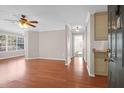 Living room with hardwood floors and access to other rooms at 188 Midland Pkwy # 205, Summerville, SC 29485