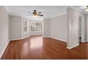 Spacious living room with hardwood floors and large windows at 188 Midland Pkwy # 205, Summerville, SC 29485