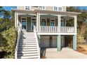 Two-story house with a large front porch and attached garage at 2084 Amenity Park Dr, Mount Pleasant, SC 29466