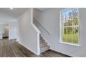 Modern staircase with carpeted steps and a gray vinyl plank floor at 209 Terrace View Dr, Summerville, SC 29486
