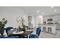 Dining area with dark wood table and blue velvet chairs at 221 Terrace View Dr, Summerville, SC 29486