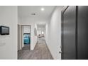 Bright hallway with wood-look floors and access to bedrooms at 221 Terrace View Dr, Summerville, SC 29486