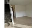 Spacious living room with tile floors and a staircase at 292 Fleming Rd # C, Charleston, SC 29412