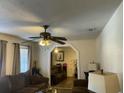 Living room with brown leather couches and ceiling fan at 4512 Logwood Dr, Ladson, SC 29456