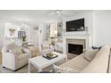 Open living space with built-ins, fireplace, and view of dining area at 4545 Park Lake Dr, Kiawah Island, SC 29455