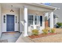 Charming front porch with white columns and a bench at 5225 Mulholland Dr, Summerville, SC 29485