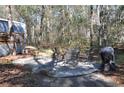 Private patio with table, chairs, and grill at 6321 Bears Bluff Rd, Wadmalaw Island, SC 29487