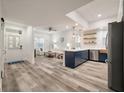Open concept kitchen boasts modern appliances and a navy blue island at 7311 Indigo Palms Way, Johns Island, SC 29455