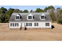 House exterior with gray roof and white siding at 8978 Victor Lincoln Rd, McClellanville, SC 29458