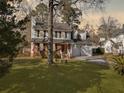 Two-story house with a two-car garage and a landscaped yard at 1001 Shinnecock Hills Ct, Summerville, SC 29483