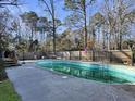 Above ground pool in backyard with wooden fence and American Flag at 1001 Shinnecock Hills Ct, Summerville, SC 29483