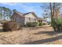 Desirable home featuring brick accents, a covered porch, and lush landscaping for added curb appeal at 101 Winston Cir, Summerville, SC 29485