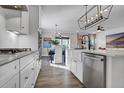 White kitchen featuring stainless appliances, a farmhouse sink, and an eat-in kitchen at 108 Crosscut Ln, Summerville, SC 29486