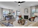 Inviting living room with fireplace, stylish decor, and an open floor plan to dining area at 108 Crosscut Ln, Summerville, SC 29486