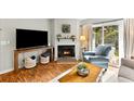 Comfortable living room with a fireplace, stylish decor, and sliding glass door at 1402 Camp Rd # Apt 9D, Charleston, SC 29412
