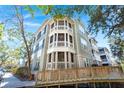 Building showcasing a corner with balconies and ramp access at 1632 Telfair Way, Charleston, SC 29412