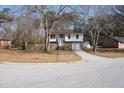 Two-story house with brick and siding, attached garage, and a landscaped yard at 210 Drexel Rd, Ladson, SC 29456