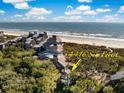 Aerial close-up of beachfront property; highlighting its unique architecture and ocean proximity at 4416 Sea Forest Dr, Kiawah Island, SC 29455
