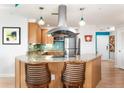 Stylish kitchen with stainless appliances, granite counters, and pendant lighting at 5804 Palmetto Dr # A-401, Isle of Palms, SC 29451