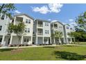 Charming apartment units with covered entrances, vibrant lawns, and scenic sidewalk access at 637 N Laurel St # 75, Summerville, SC 29483