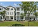 Beautiful apartment complex featuring covered porches, lovely greenery, and stunning architectural detail at 637 N Laurel St # 75, Summerville, SC 29483