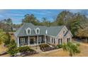 Spacious home on a large lot with mature trees and landscaping at 788 Awendaw Lakes Blvd, Awendaw, SC 29429