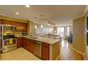 Modern kitchen featuring stainless steel appliances and granite countertops at 8000 Palmetto Dr # 505, Isle of Palms, SC 29451
