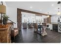 Spacious open concept layout with brick accents and seamless flow between rooms at 120 Charleston Blvd, Isle of Palms, SC 29451