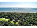 Aerial view of golf course community with home close to beach and 'The Sandcastle' at 1365 Dunlin Court, Share C, Kiawah Island, SC 29455