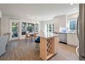 Open concept kitchen featuring center island with seating and dining area with outdoor views at 1365 Dunlin Court, Share C, Kiawah Island, SC 29455
