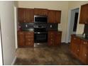 Nice kitchen with stainless steel appliances, custom cabinets, and a tile floor at 1382 Doctor Evans Rd, Moncks Corner, SC 29461